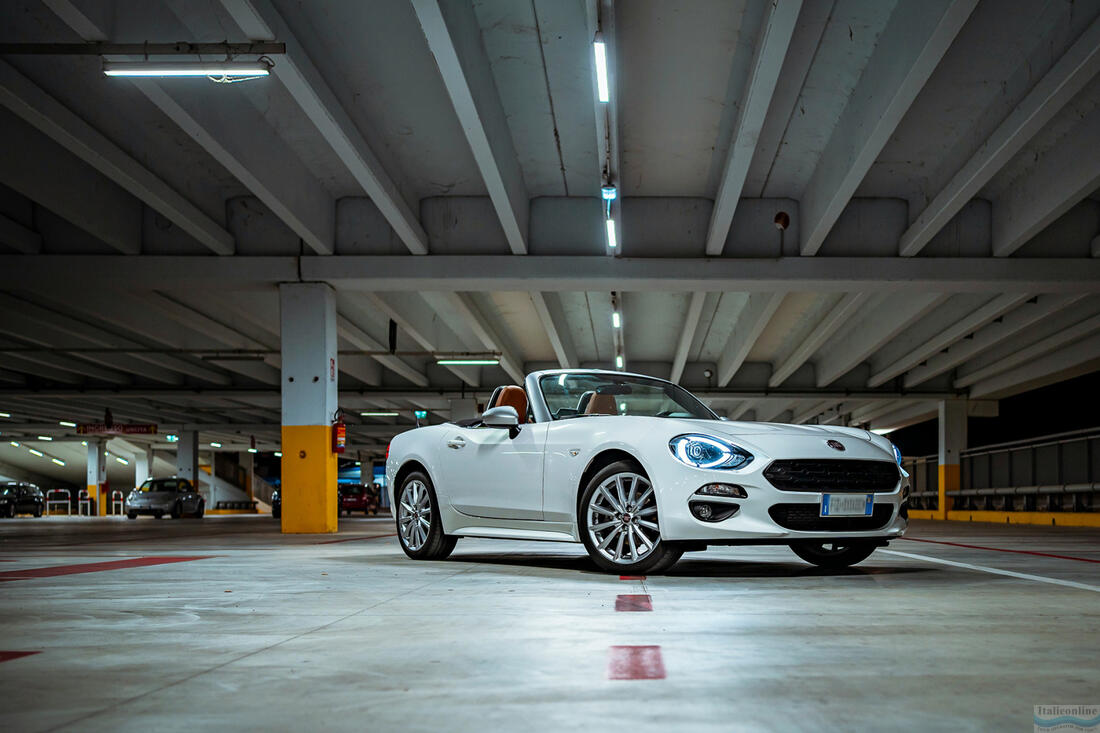 Fiat 124 Spider in a parking lot, Abruzzo, Italy